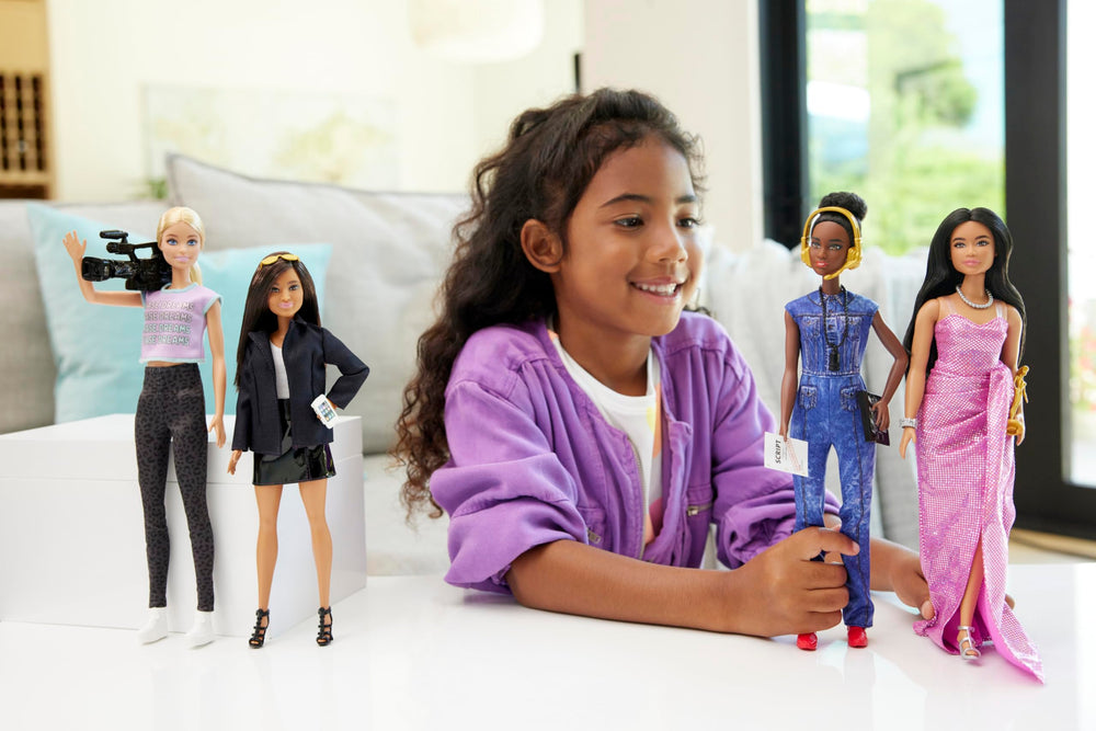 Barbie Careers Studio Executive wearing sunglasses for modern professional style.