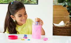 Barbie Chelsea Color Reveal doll showing metallic pink color-change effect for magical reveals