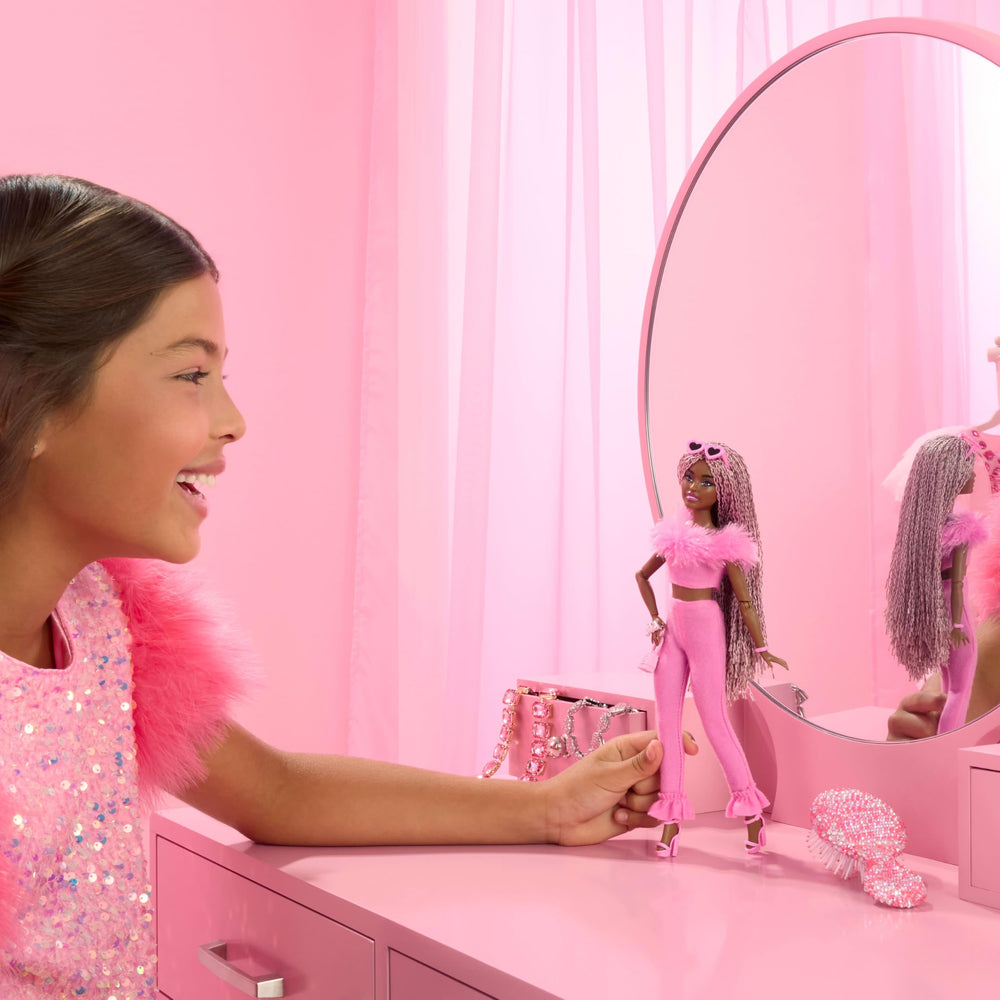 Barbie Deluxe Style doll in soft pink top and pants invites creative styling.