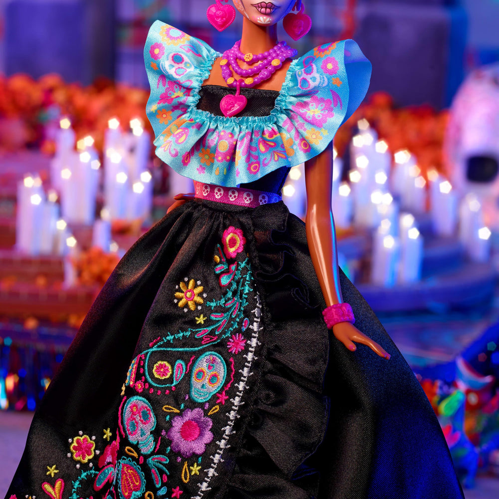 Barbie Dia de Muertos candy necklace and pink ring for playful accents.