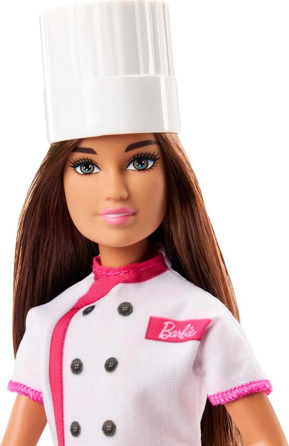 Barbie doll hand shows cupcake accessory for serving play.