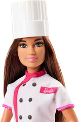 Barbie doll hand shows cupcake accessory for serving play.