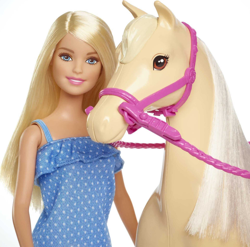Barbie sits on the saddle with bent knees for a realistic riding pose.