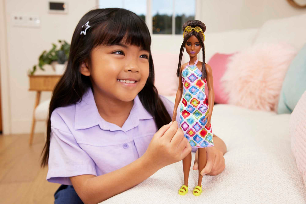 Barbie Fashionistas #210 crochet halter dress adds colorful, comfy fashion for imaginative play.