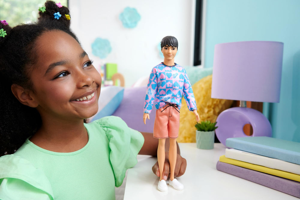 Barbie Fashionistas Ken doll pattern shirt close-up highlights hearts and flowers for creative styling.