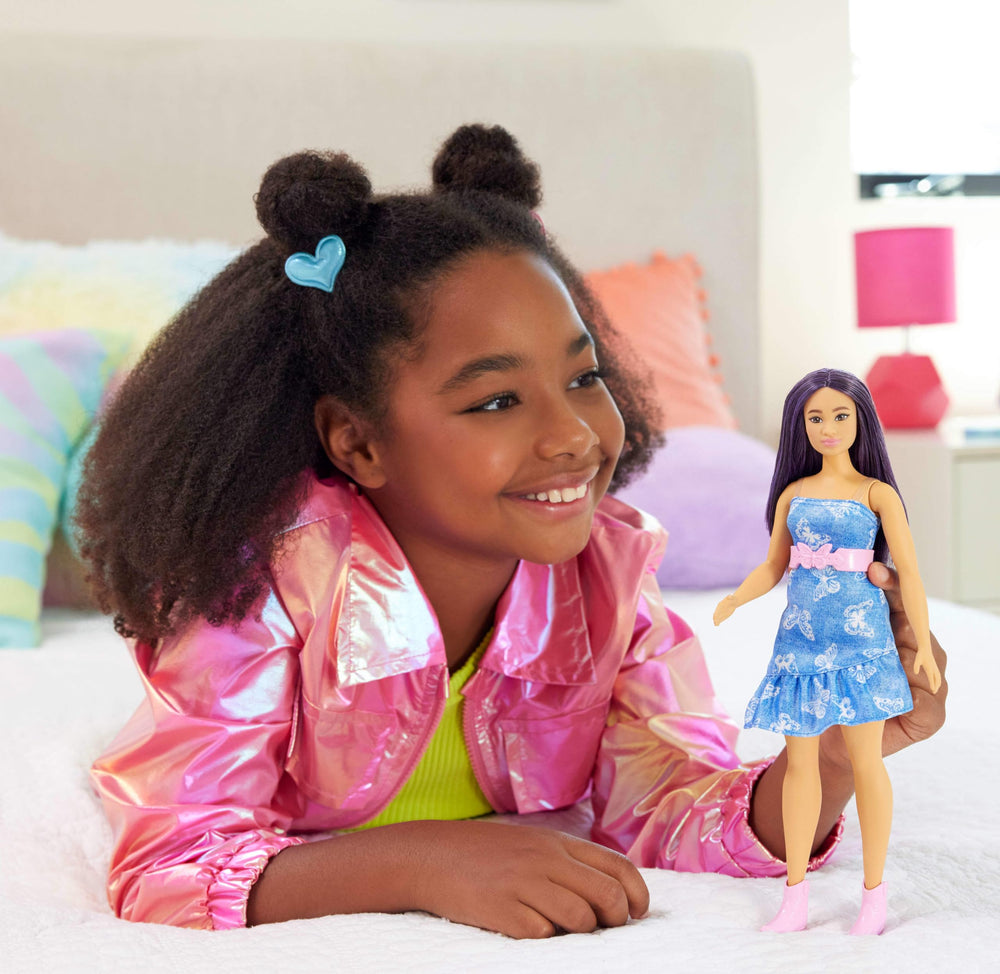 Barbie Fashionistas doll in strapless denim dress with butterfly print sparks creative wardrobe stories.