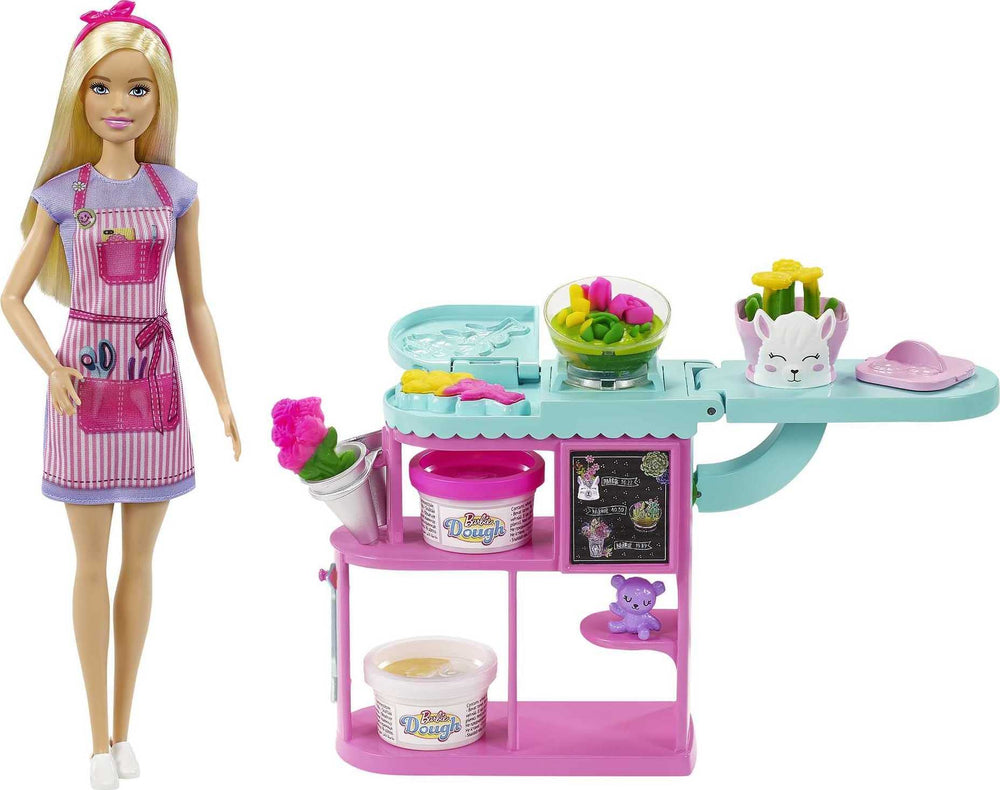Barbie florist doll at the flower-station inspires imaginative shop play.