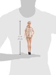 Barbie Jane Goodall doll with notebook encourages journaling during pretend expeditions.
