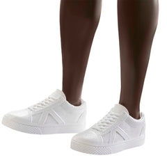 Barbie Ken Fashionistas 203 white sneakers complete the sporty look.