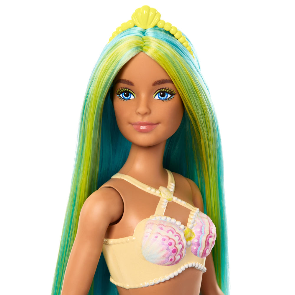 Barbie mermaid doll shows shell bodice and turquoise tail