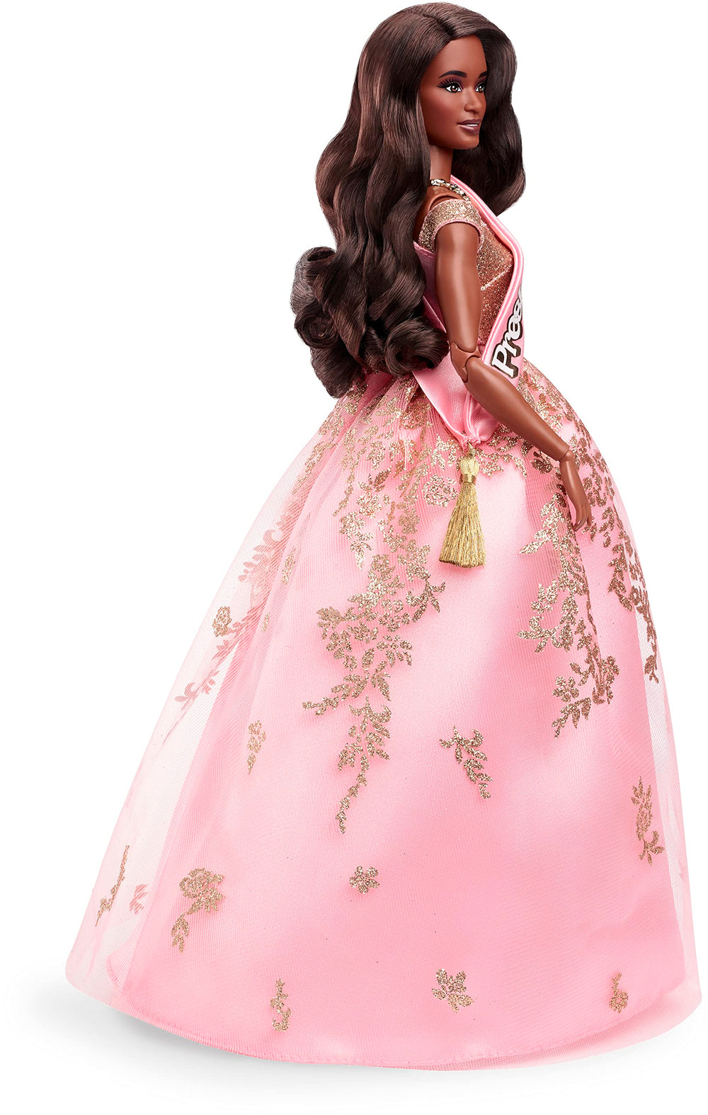 Barbie President Doll glows with shimmering details and satin sash.