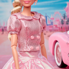 Barbie The Movie doll hair styled in side twist with ribbon tie.