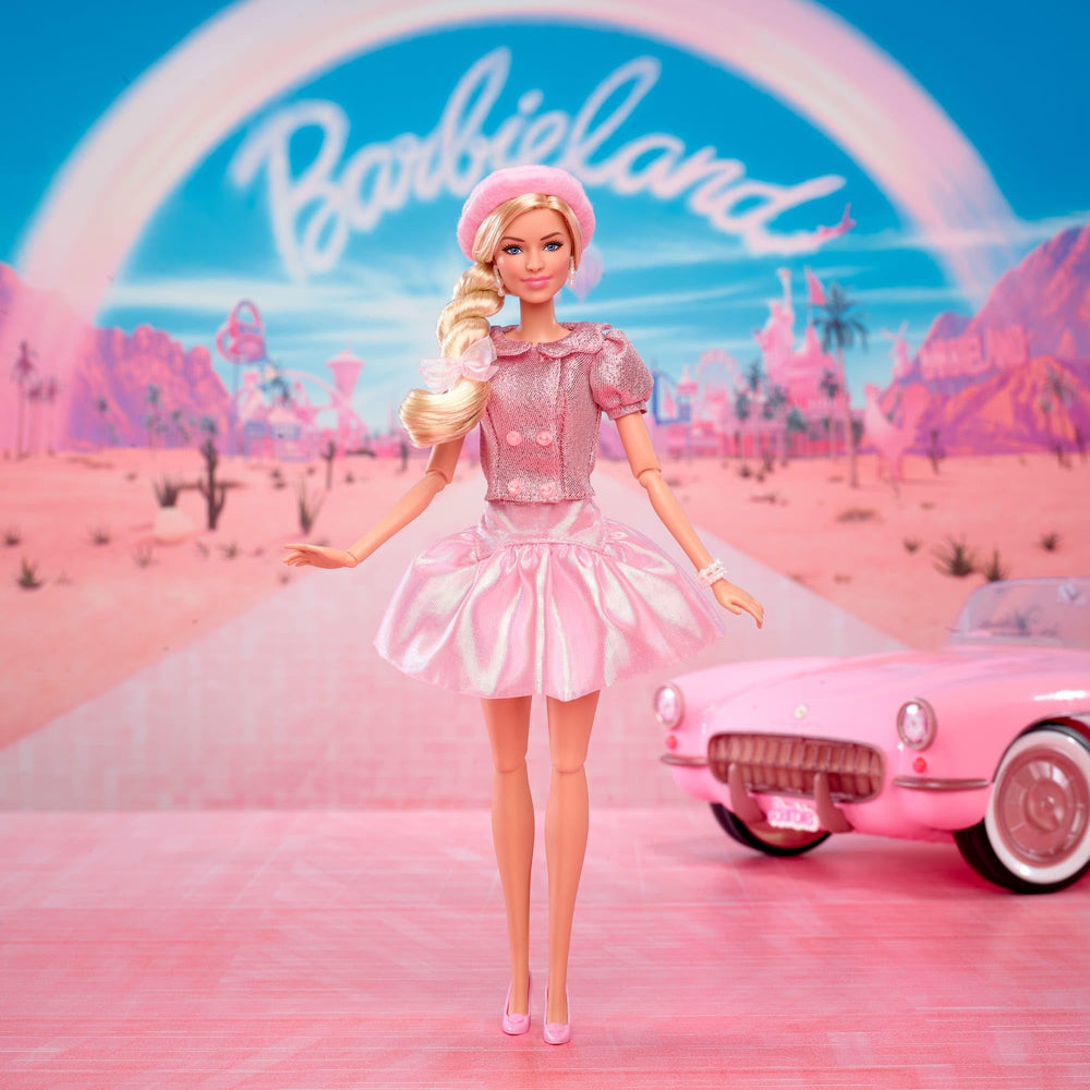 Barbie pink heels on movie doll, completing a chic on-set look.