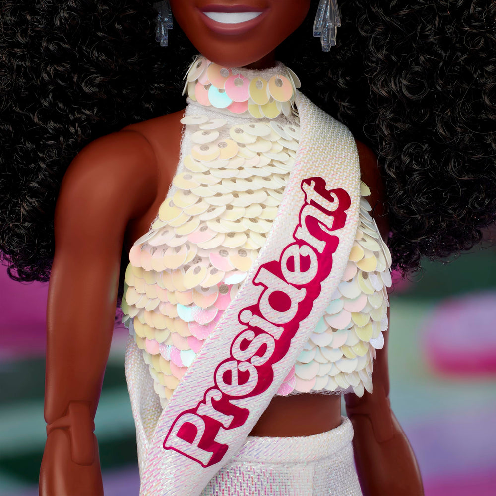 Barbie The Movie President sash detail adds a refined finish for shelf display.
