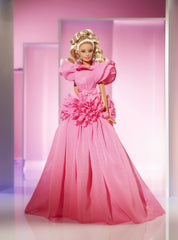 Barbie pink chiffon gown with ruffles, elegant display-worthy attire.