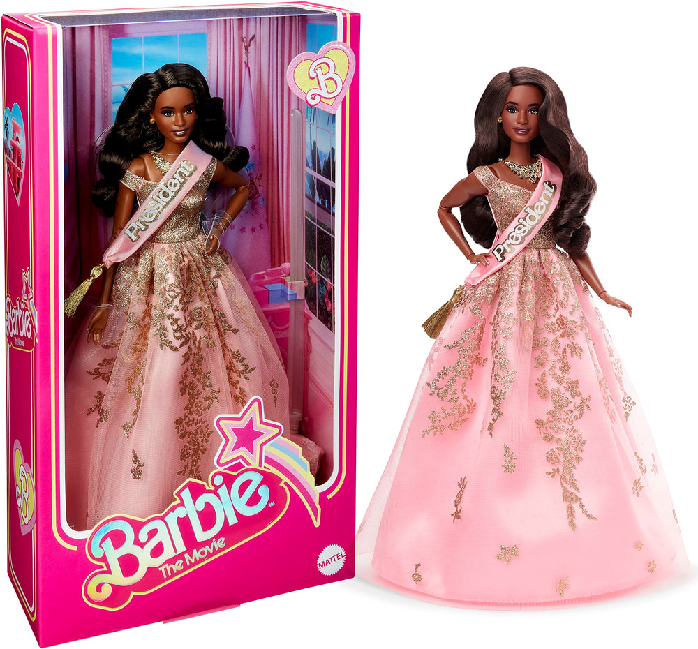 Barbie The Movie President Doll wearing shimmery pink gown and sash for display.