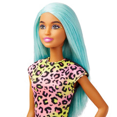Barbie doll wearing print-on apron for salon-themed storytelling.