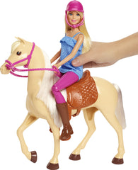 Barbie wearing riding outfit with pink pants and denim top.