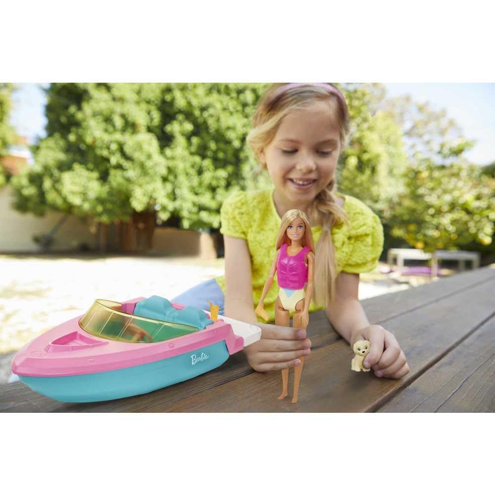 Barbie speedboat floats on water for safe, pretend cruises during bath time.