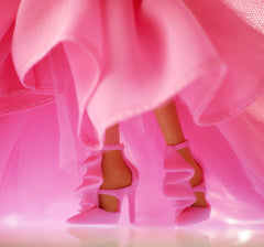 Barbie strappy high heels with ruffle details complete the outfit.