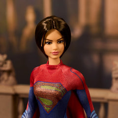 Barbie Supergirl cape flowing red adds cinematic flair for imaginative hero play.