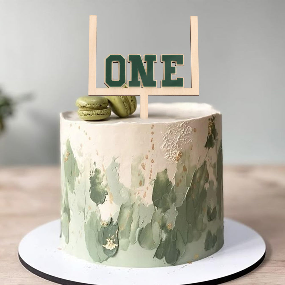 BEADED football cake topper doubles as a photo prop for milestone moments.
