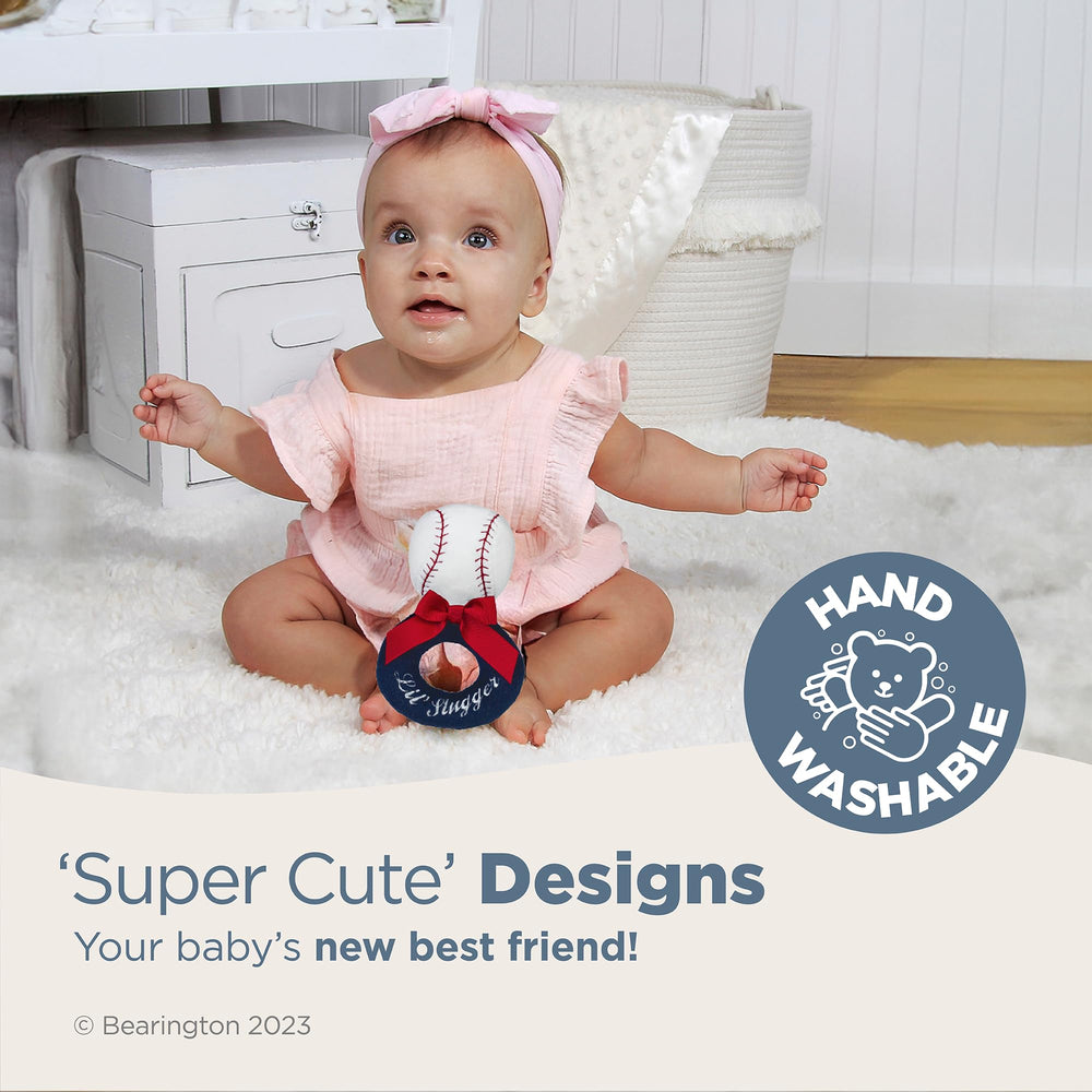 Baby grips the soft baseball rattle, promoting early motor skills through gentle shaking.