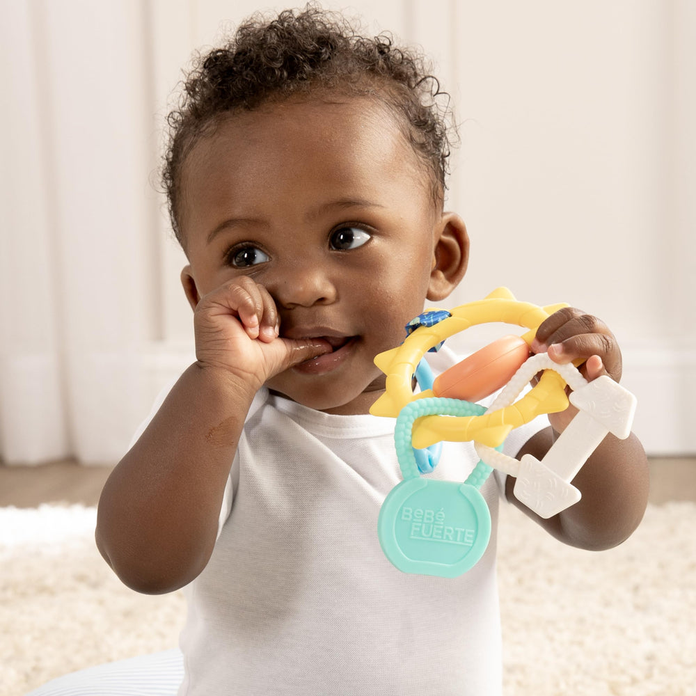 BEBÉ FUERTE clip-on travel toy attached to a stroller