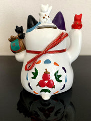 Betterdecor Maneki Neko on a shelf adds cultural charm and warmth.