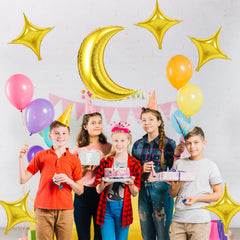 Biapian moon and star balloons in a photo-ready setup for celebration