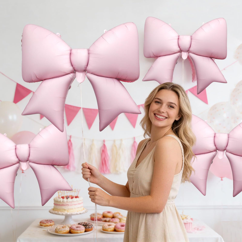 Biapian pink bow balloon with straw for easy inflation.