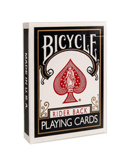 Family game night with Rider Back decks on a wooden table.