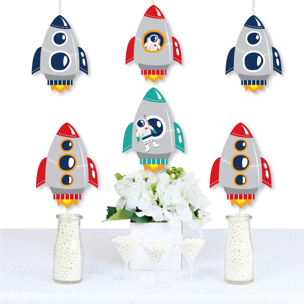 Big Dot of Happiness space party cutouts arranged as centerpieces.