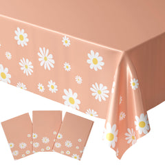 Blue Orchards Daisy Table Cover three-pack on a dining table with daisies.