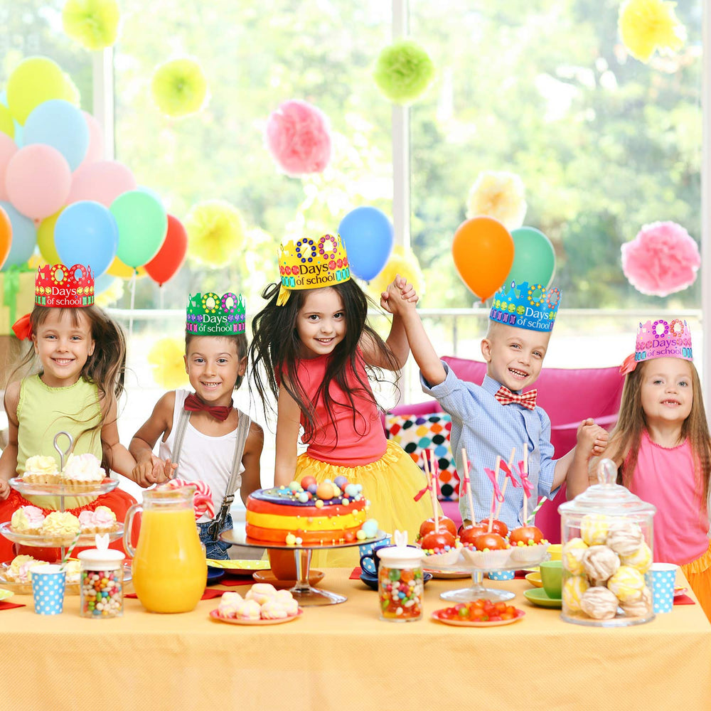 Blulu 100 Days crowns on party table ready for photos.