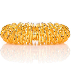 Blulu acupressure fidget ring in gold provides discreet finger massage at meetings or classes.