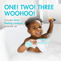 Boon Water Bugs mint-colored toys floating in water for sensory play.
