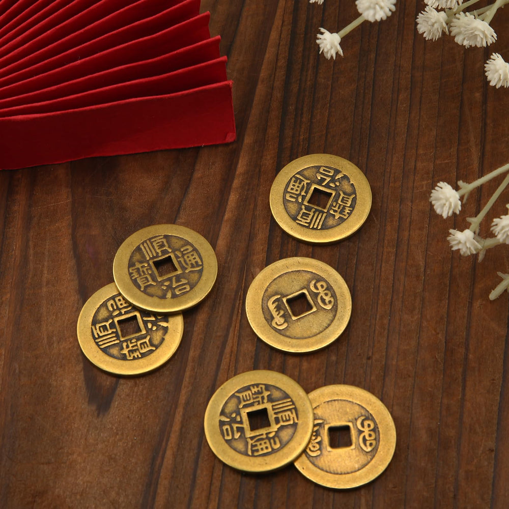 BOXOB coins on a table display showing size and brass sheen.