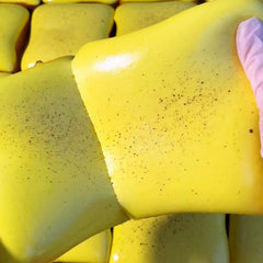 Bread Butter Squishy in hand demonstrating portable fidget toy for focus