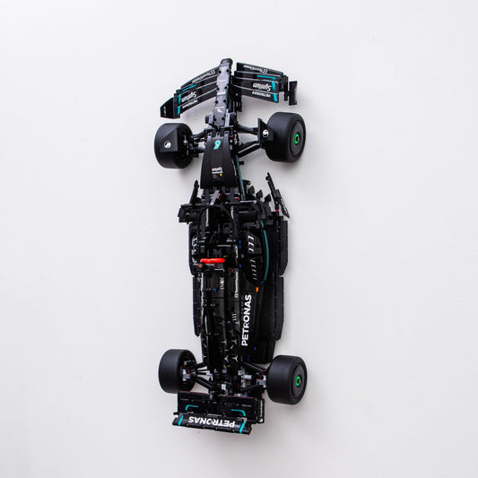 Brickify wall mount securely displays the 42171 Mercedes F1 model on the wall.