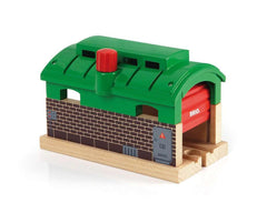 Close-up of the Brio Train Garage red knob for door control.