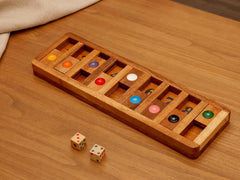 BSIRI Shut The Box components arranged with dice and tiles for play.