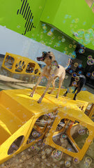 Bubbletastic bubble play in yard features outdoor entertainment for dogs.
