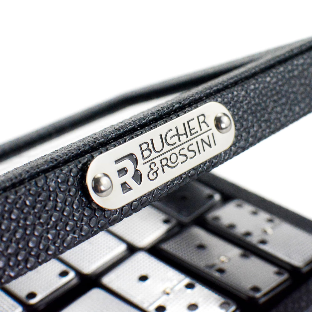 Classic black Bucher&Rossini domino tiles spread on a table for play