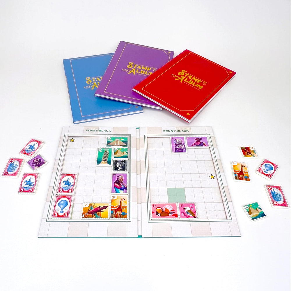 Buffalo Games Penny Black mail bag and stamps organized for an engaging game night.