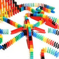 Pro-Dominoes pieces spread across a flat surface for cascading topple