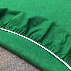 CAIT CHAPMAN HOME COLLECTION washable green felt table cover ready for easy cleanup after play.