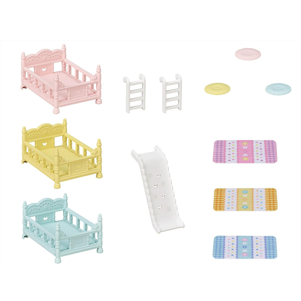 Calico Critters pastel pillows and duvets brighten the setup for cozy storytelling.