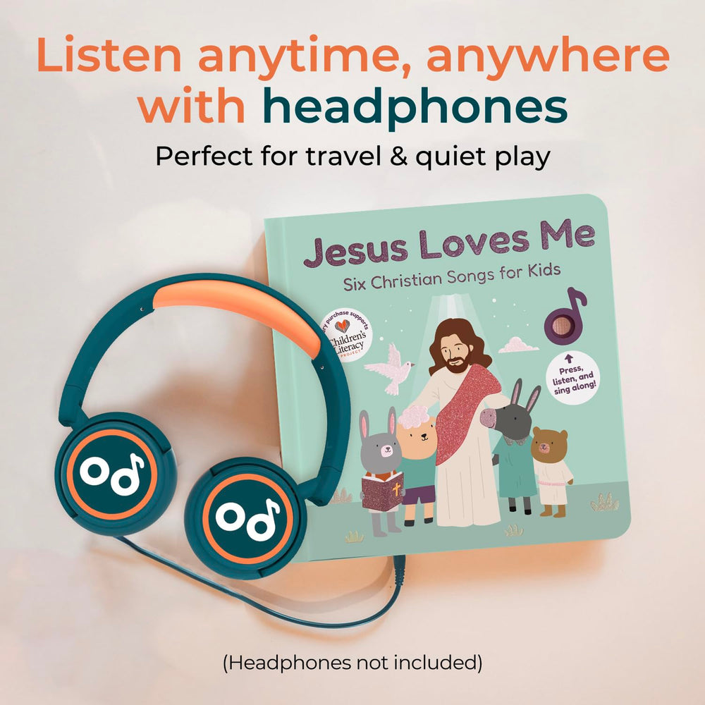 A toddler plays and sings along with the interactive pages.