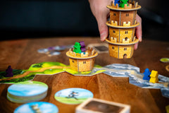 Capstone Games Wandering Towers movement cards guide turns and actions.